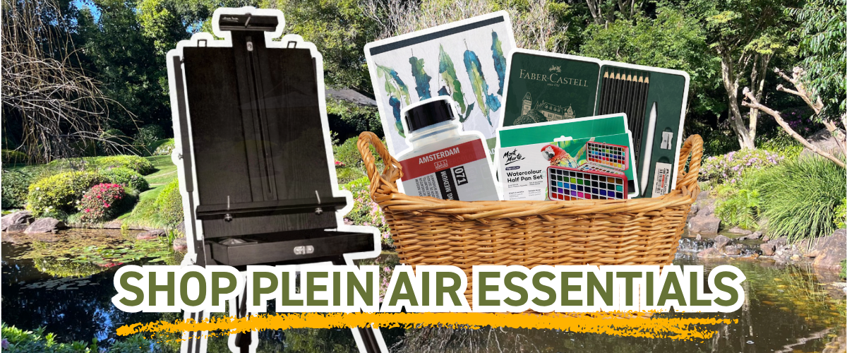 Black French box easel beside a basket of plein air supplies including Amsterdam medium and Faber-Castell pencils