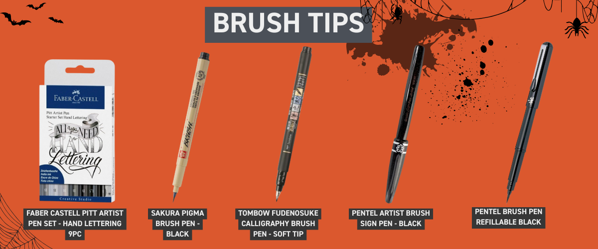 Assorted brush pens ideal for calligraphy and Inktober brush inking, arranged beside ink drawings and paper pads.