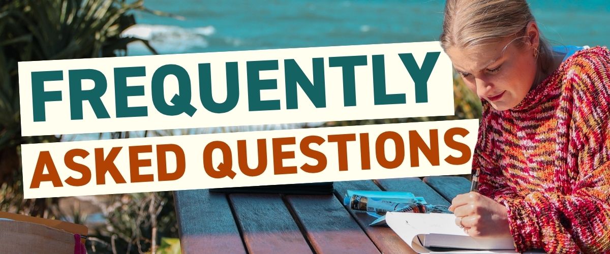 Frequently asked questions, artist writing notes at an outdoor table by the coast